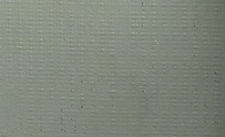 Поверх сітки за допомогою шпателя нанесіть ще один шар клею.